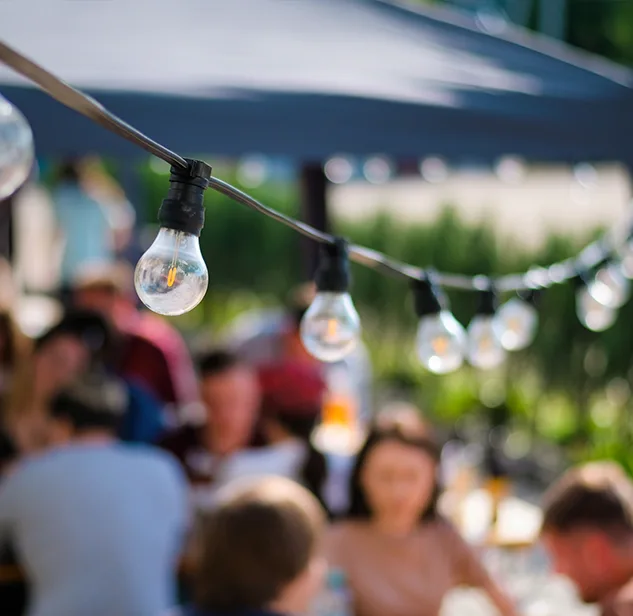 decorative lights of a festival with blurred people on the background