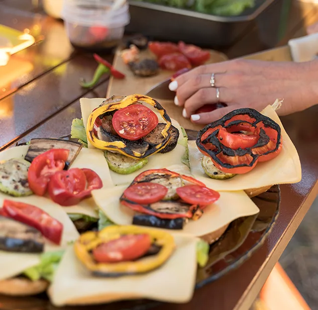 hands preparing traditional sardinian food in a food fair