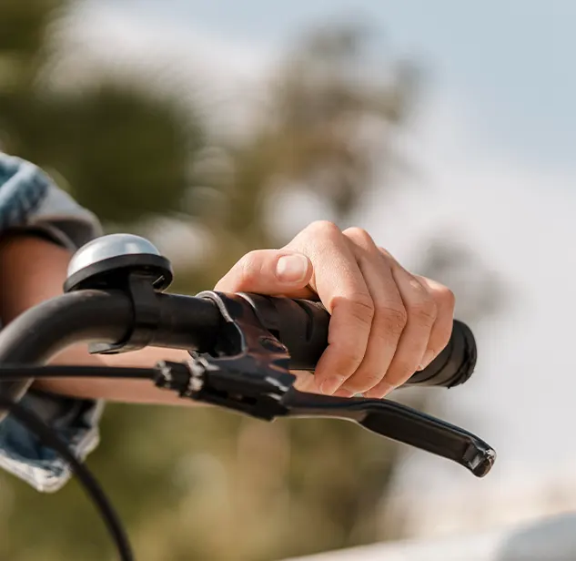hand of a rider on a mountain bike handlebar